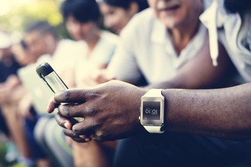 Group of diverse people using digital devices