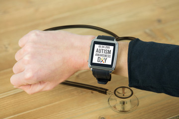 Businesswoman with smart watch on wrist against metal black stethoscope