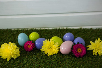 Multicolored Easter egg on grass