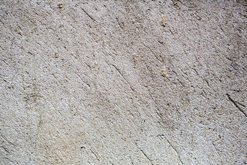 plastered wall close-up. texture of plaster with cracks.