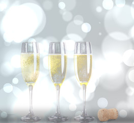 Close up of a cork against three full glasses of champagne