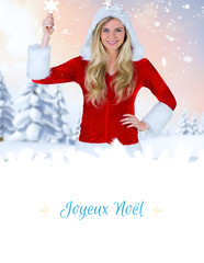 pretty girl in santa outfit holding hand up against border