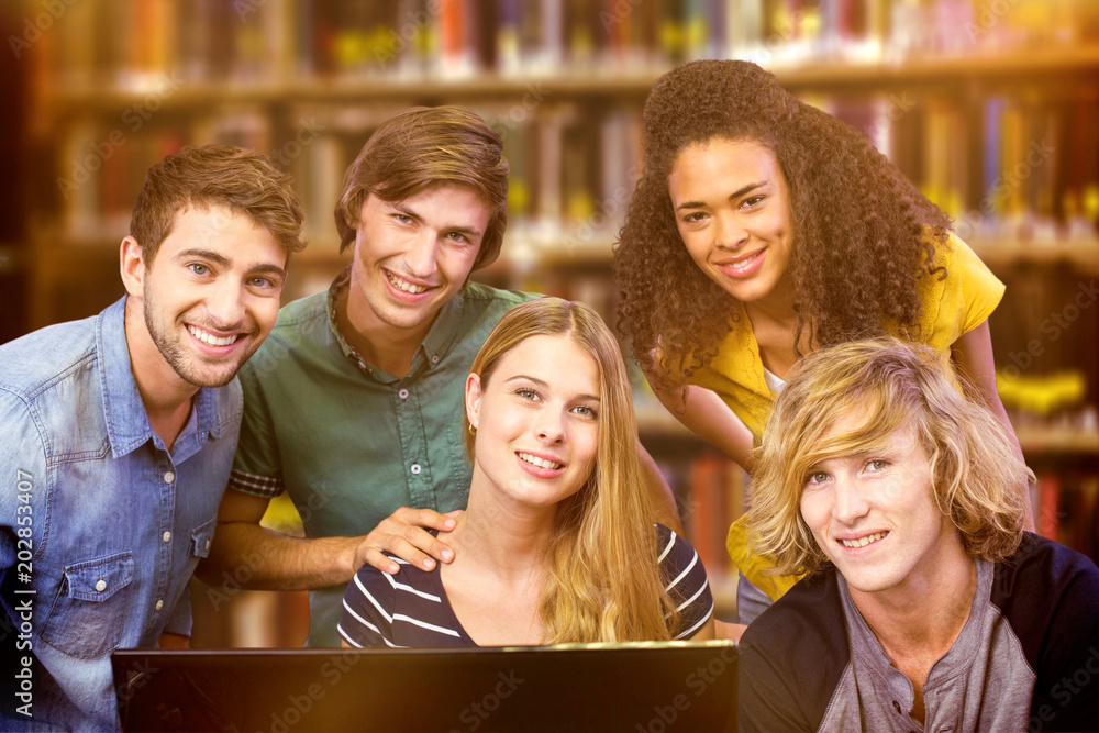 Poster college students using computer against close up of a bookshelf