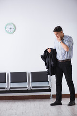 Man nervously impatiently waiting in the lobby