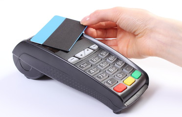 Using payment terminal with contactless credit card, finance and banking concept