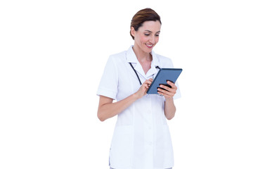 Smiling doctor using tablet