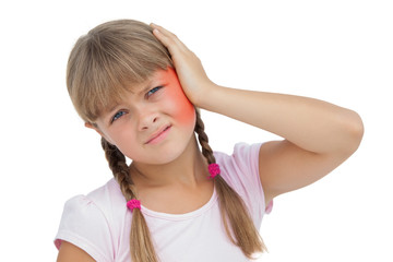 Little girl suffering from earache on white background 