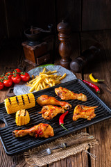 Rustic Grilled chicken wings,legs,and spicy corn