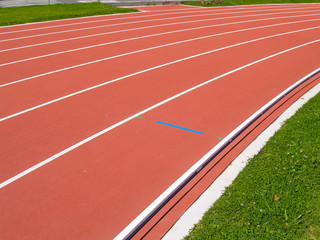 Bright red synthetic running track
