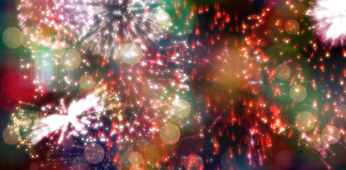Digitally generated colourful fireworks exploding on black background