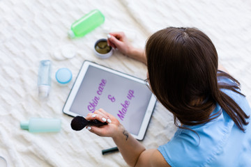 Woman reading an article about skincare