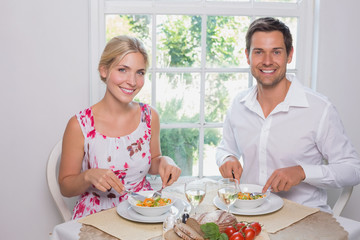 Portrait of a happy couple having food