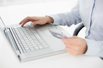 Close up mid section of a woman doing online shopping