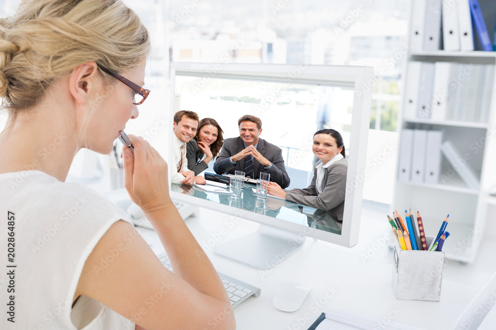 Aufkleber portrait of a positive manager with his team against rear view of a female photo editor working on c