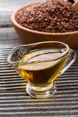 flaxseed and oil on a rustic background