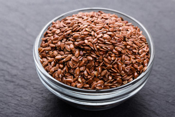 flaxseed and oil on a rustic background