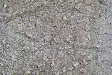 Abstract texture of a rough gray concrete wall.