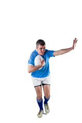 Fototapeta na wymiar Rugby player running with the rugby ball