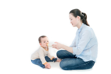 Mother is feeding the baby, white background