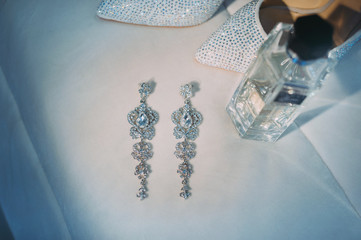 beautiful earrings of the bride. wedding accessories - obrazy, fototapety, plakaty