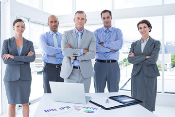 Business team working happily together on laptop