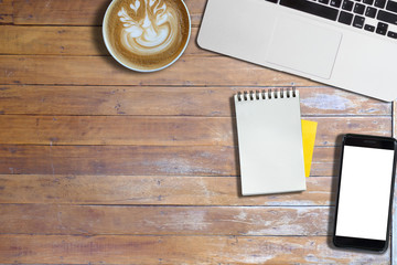 Hot art cappuccino on wooden table with office object and phone, copy space, mock up, for presentation