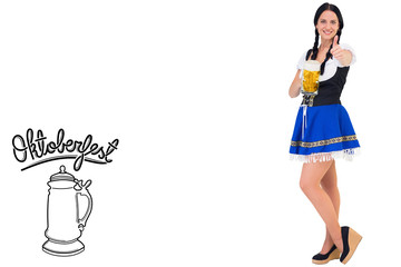 Pretty oktoberfest girl holding beer tankard against oktoberfest graphics