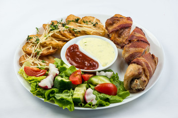 Delicious Chicken rolls with cheese and bacon on a plate close-up. horizontal