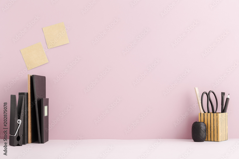 Sticker Desk with books and design supplies. 