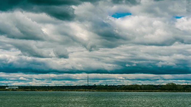 Landscape dark rainy clouds moving fast time lapse