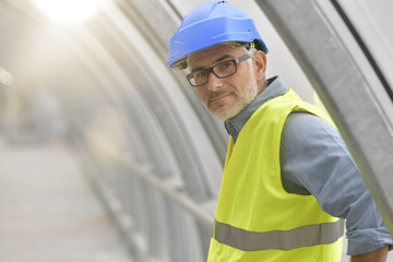 Portrait of industrial engineer with security hat and lifevest
