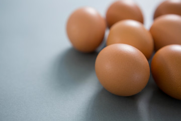 Brown eggs on grey background
