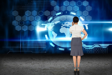 Thoughtful businesswoman against earth interface on abstract screen