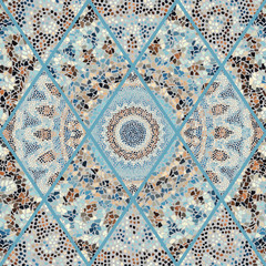 Seamless background pattern. Irregular decorative geometric mosaic art tile pattern from uneven broken pieces. Vector image.