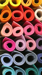 rolls of fabric in the rack of the tailoring