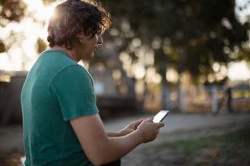 Man using mobile phone in the ranch