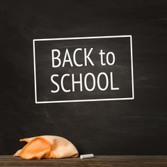 black chalkBoard. chalk and rag lie against. concept: back to school background. text , inscription