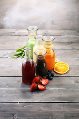 Selection of colorful smoothies on rustic background