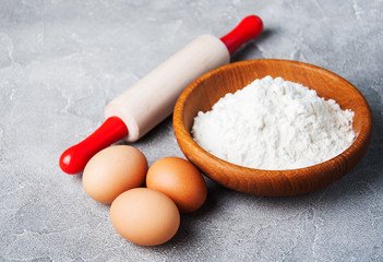 Obraz na płótnie Canvas Baking ingredients - flour, eggs and pin