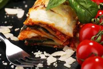 Serving of spicy traditional Italian beef lasagne in a restaurant