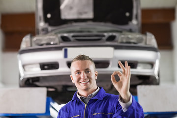 Mechanic doing a gesture with his fingers
