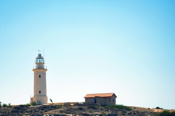 Fototapeta na wymiar Lighthouse on beach in Paphos, Republic of Cyprus