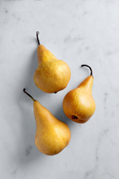 Fresh pears viewed from above on a marble background. Top view