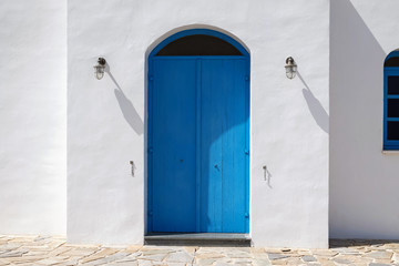 Fototapeta premium Facade of building with blue doors.