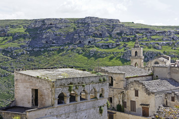 Fototapeta na wymiar Italy, Basilicata, a part of the ancient city of Matera, called Sassi and rock caves from the early period of settlement, Unesco Unesco