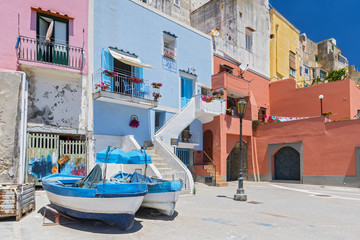 Traditional boats and specific architecture near Marina Corricella on the island of Procida, bay of Naples, Italy.