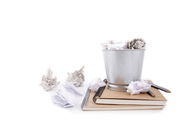 Crumpled paper can recycle to metal basket bin on white background ,concept for business frustration