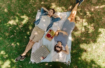 Foto op Plexiglas Couple relaxing on a picnic at park © Jacob Lund