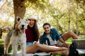 Couple on picnic with pet dog