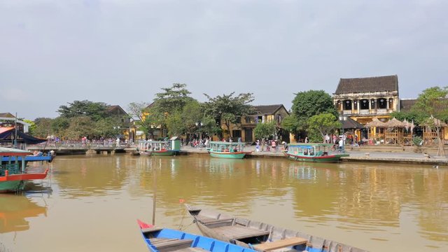 Panning shot of Hoi An old quarter and Thu Bon River, Vietnam in 4k

